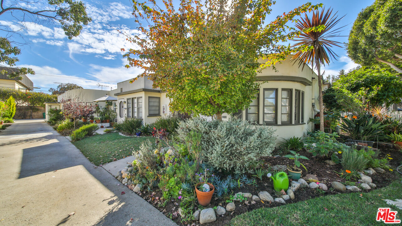 1502 Maple Street Santa Monica, CA 90405 - Photo 9 of 16 a front view of a house with a yard and potted plants