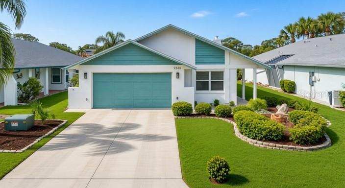 4536 Mitcher Road New Port Richey, FL 34652 - Photo 1 of 46 a view of a house with a garden