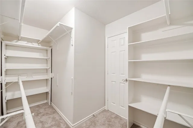 a view of an empty walk in closet