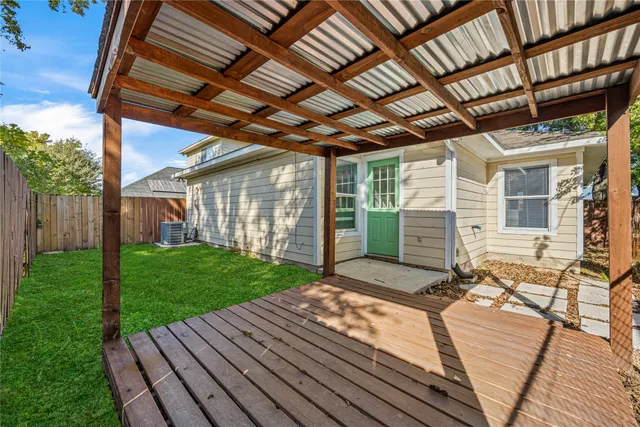 a view of a backyard with sitting area