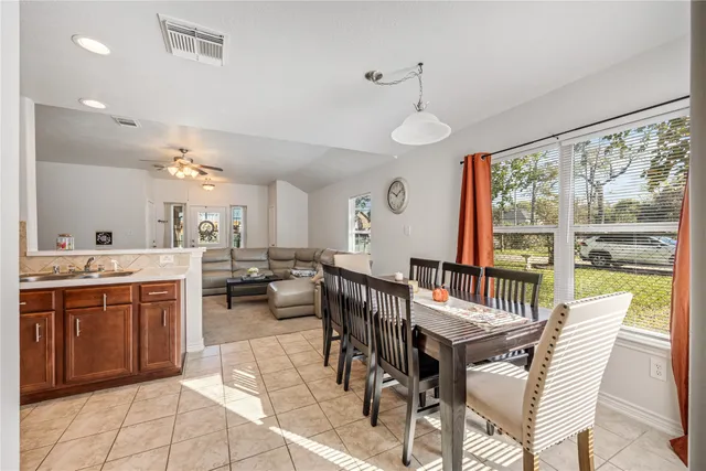 a view of a dining room with furniture window and outside view