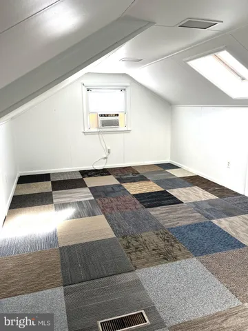 a living room with a bed