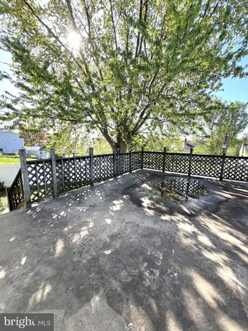 a view of a yard with a tree