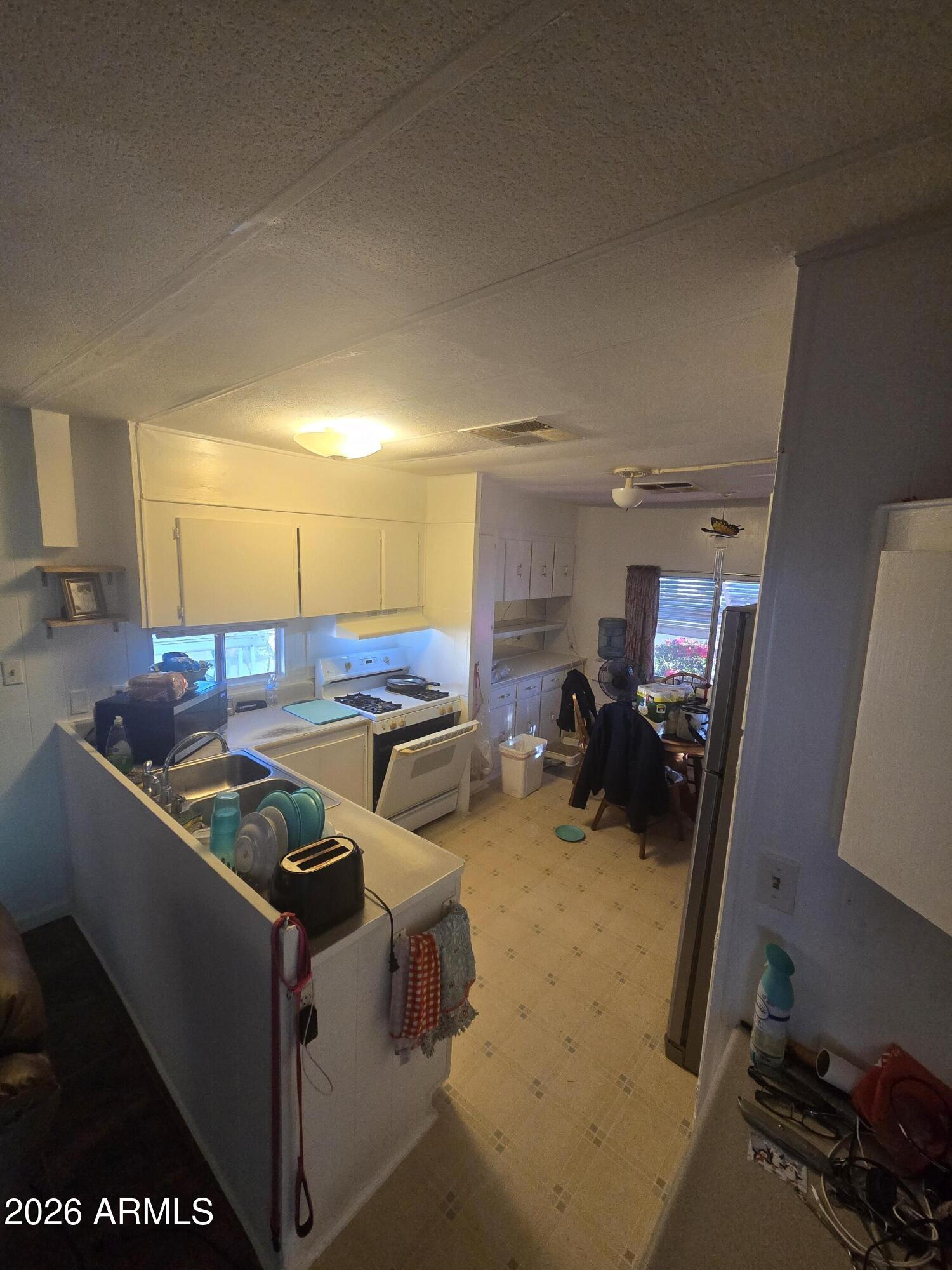 269 North Winchester Road, Unit 26 Apache Junction, AZ 85119 - Photo 5 of 18 a view of a room with gym equipment
