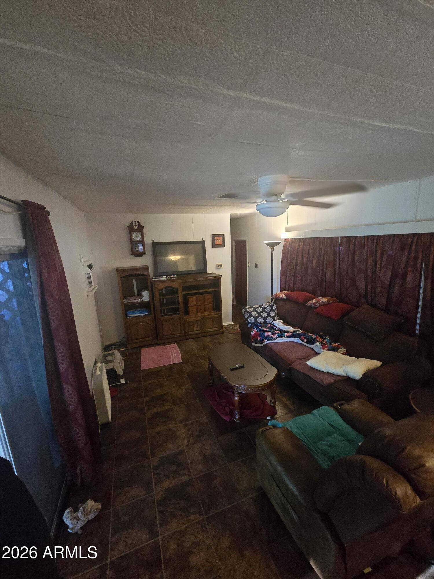 269 North Winchester Road, Unit 26 Apache Junction, AZ 85119 - Photo 7 of 18 a room with furniture and a rug