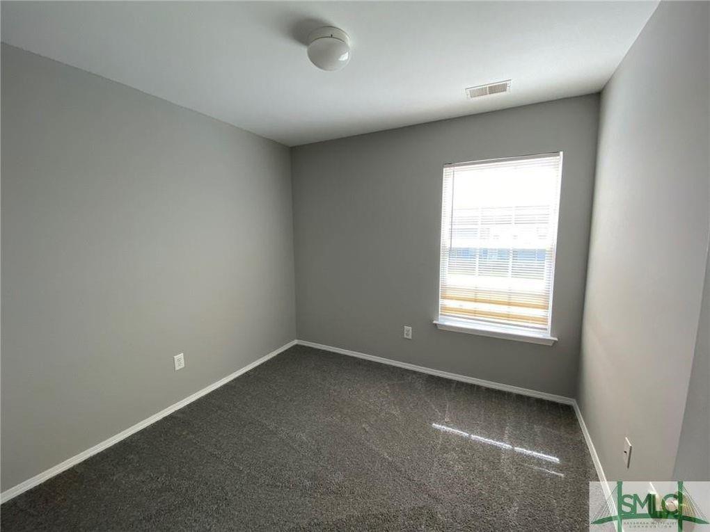 57 Timber Crest Court Savannah, GA 31407 - Photo 12 of 22 an empty room with a window
