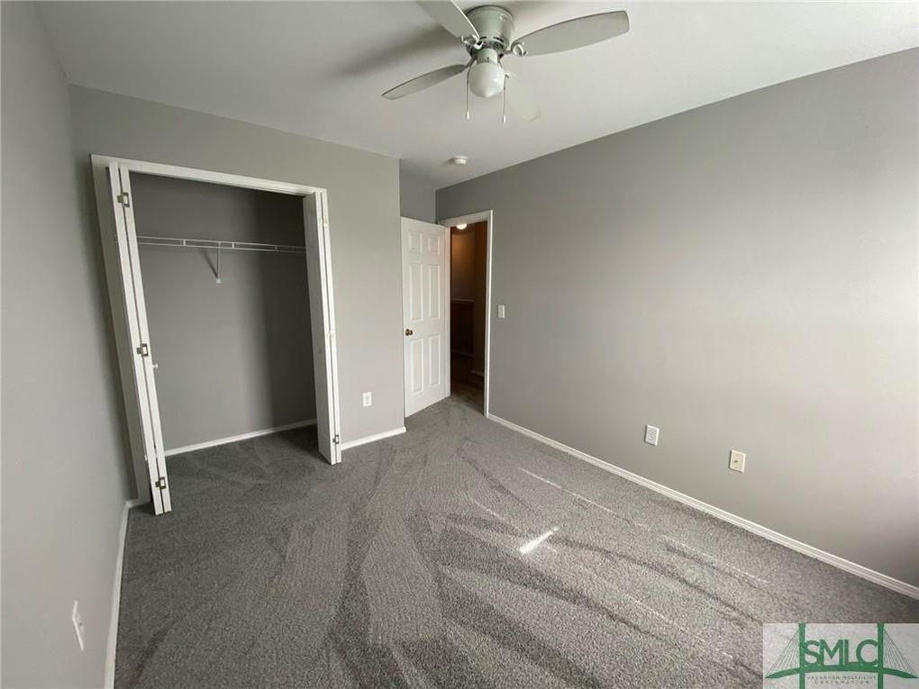 57 Timber Crest Court Savannah, GA 31407 - Photo 15 of 22 an empty room with closet and a ceiling fan