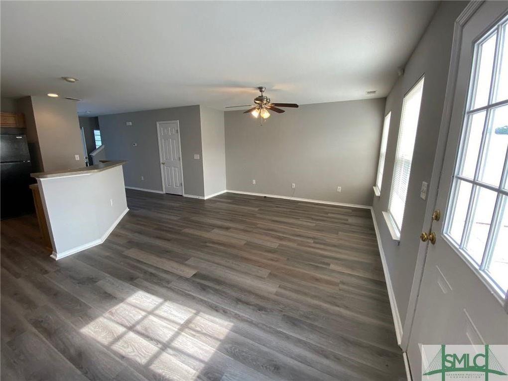 57 Timber Crest Court Savannah, GA 31407 - Photo 4 of 22 wooden floor in an empty room with a window