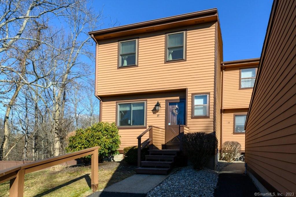 71 Cedar Knolls Drive, Unit 71 Branford, CT 06405 - Photo 1 of 34 a view of a house with couches and wooden floor