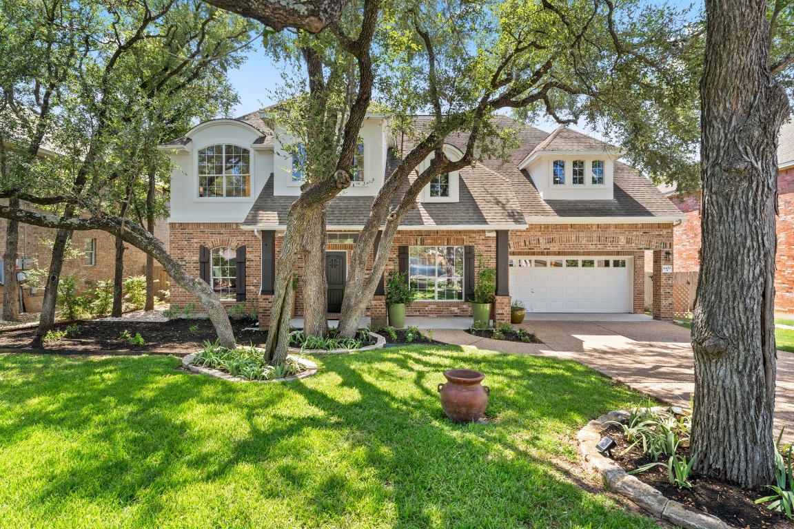 6428 Magenta Lane Austin, TX 78739 - Photo 1 of 1 a view of a house with a yard