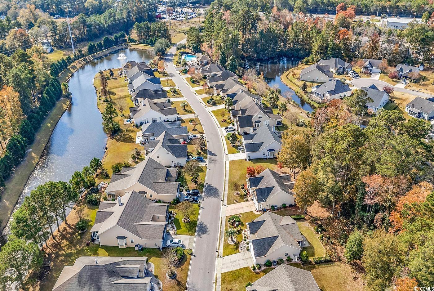 153 Myrtle Grande Drive Conway, SC 29526 - Photo 36 of 40 Aerial view of property's location with a large body of water and nearby suburban area