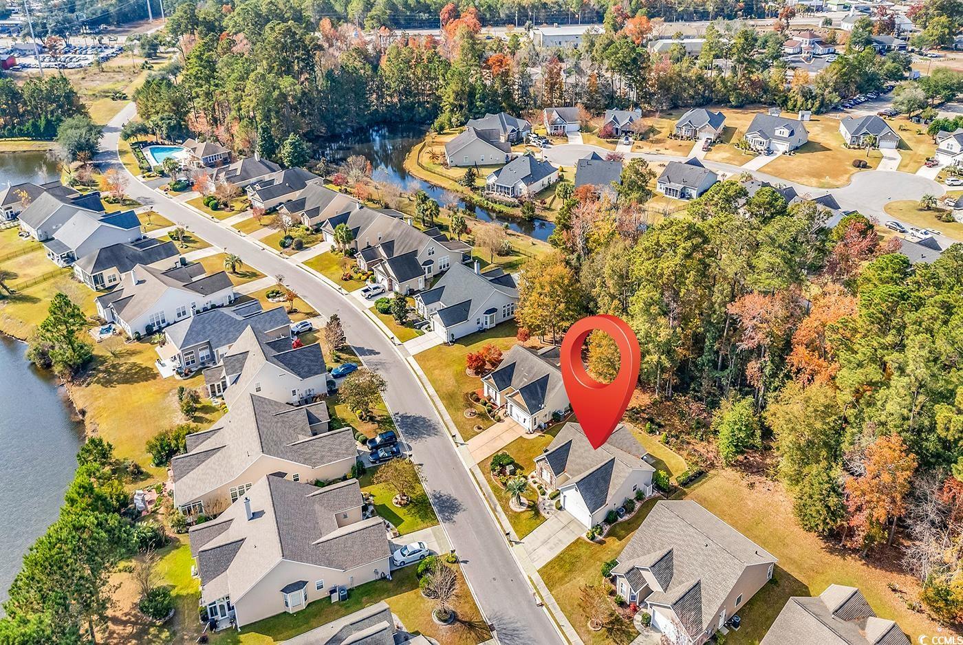 153 Myrtle Grande Drive Conway, SC 29526 - Photo 38 of 40 Aerial view of property and surrounding area with nearby suburban area and a large body of water