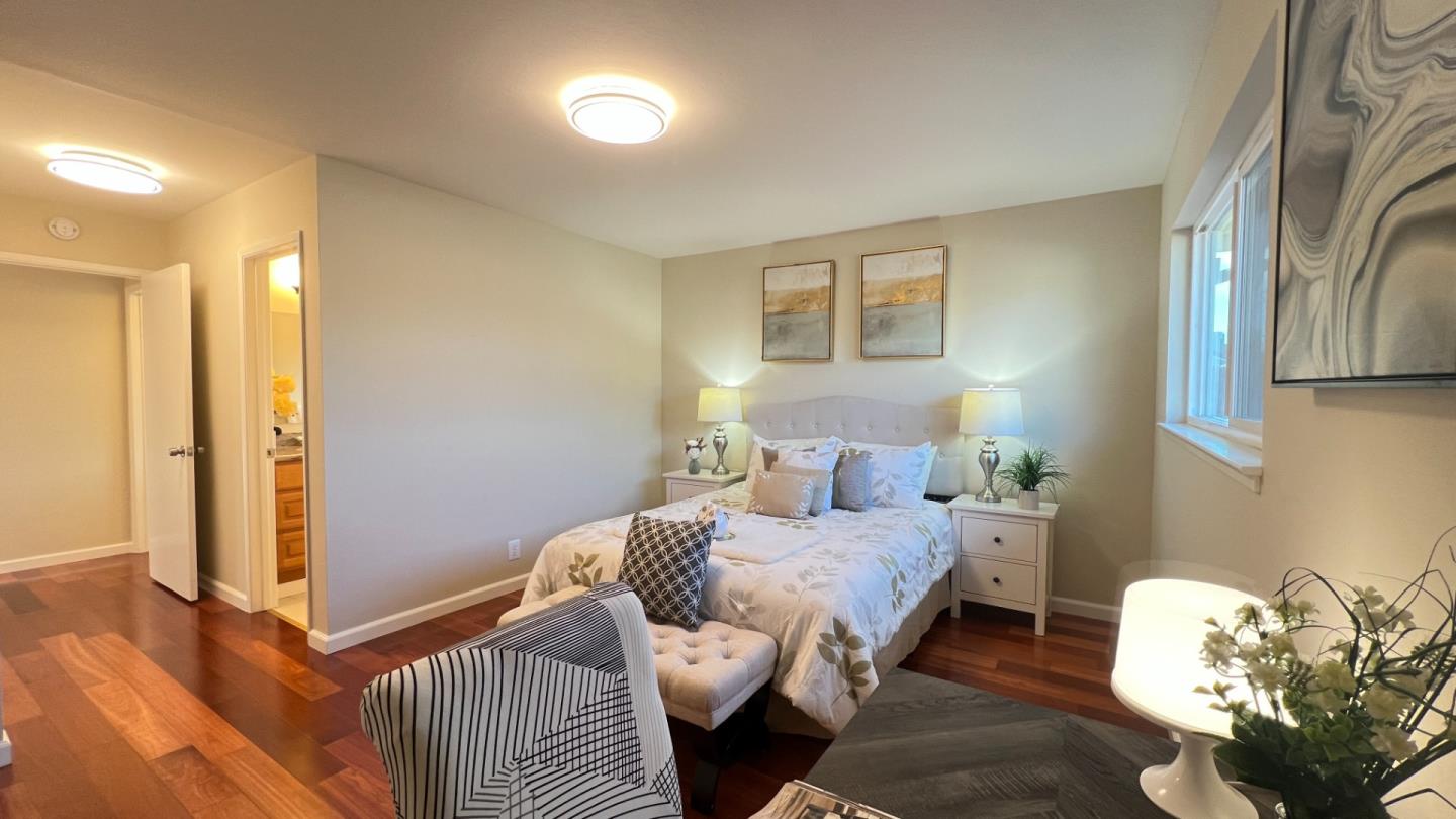802 Humewick Way Sunnyvale, CA 94087 - Photo 6 of 11 a bedroom with bed and a window