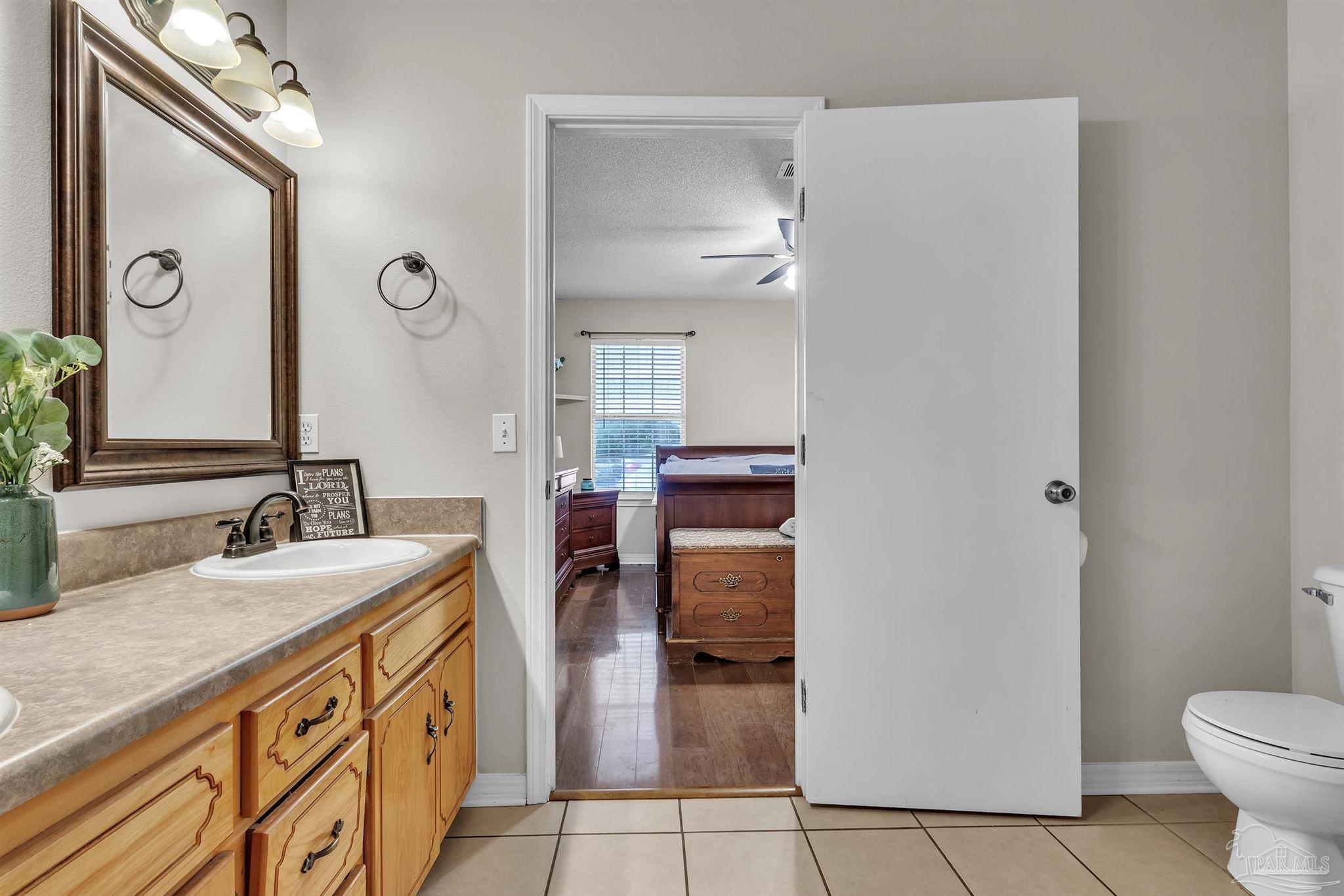 1770 Annie Penton Road Jay, FL 32565 - Photo 23 of 35 a bathroom with a sink and a mirror