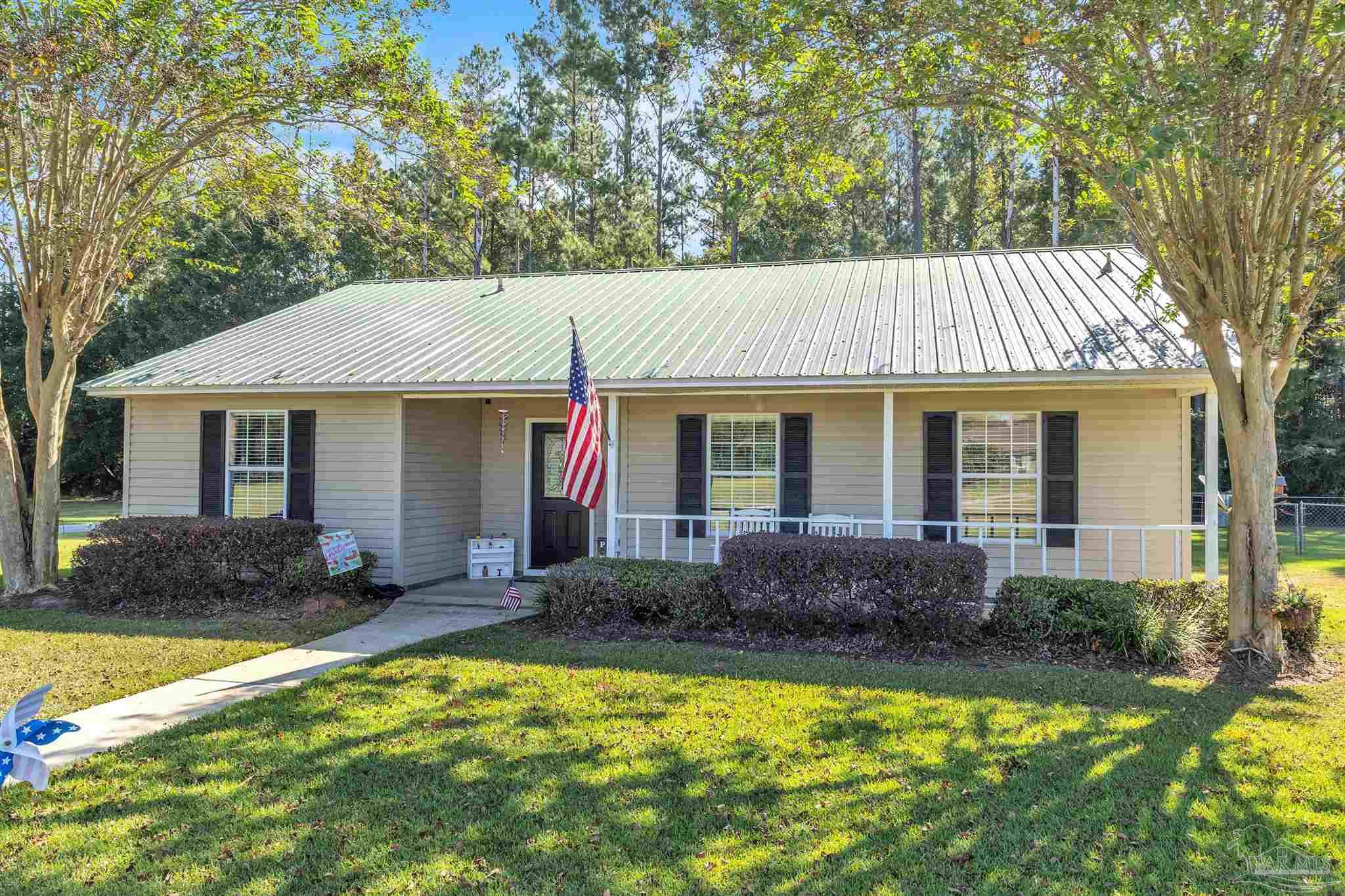 1770 Annie Penton Road Jay, FL 32565 - Photo 29 of 35 a front view of house with yard and outdoor seating