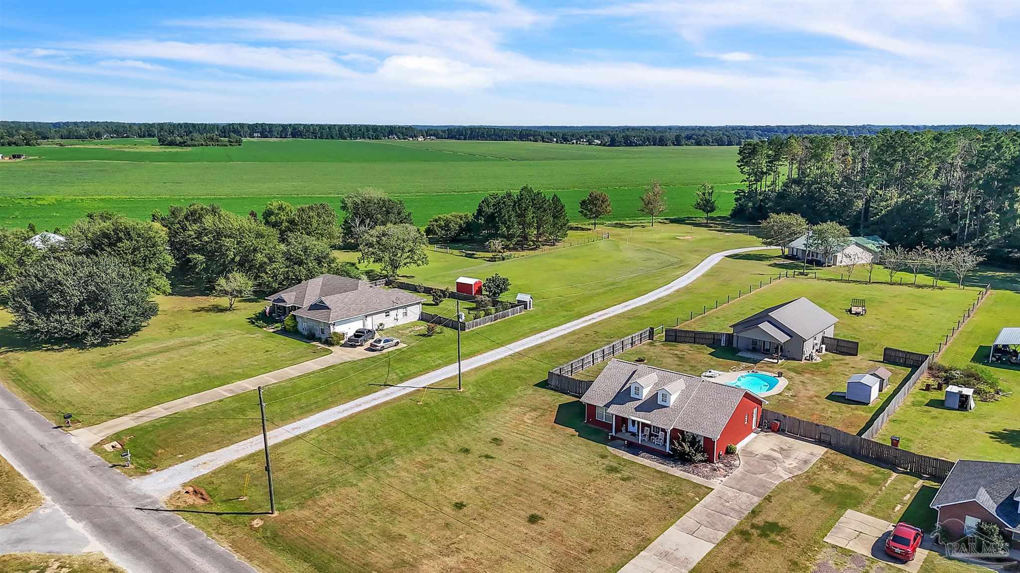 1770 Annie Penton Road Jay, FL 32565 - Photo 30 of 35 a view of a swimming pool and lounge chair