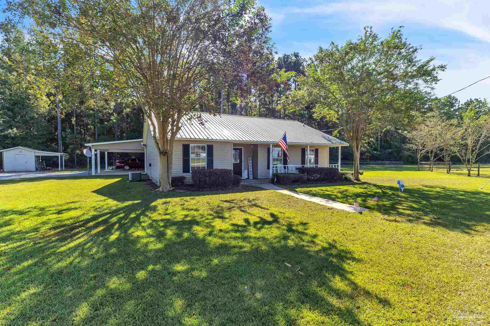 1770 Annie Penton Road Jay, FL 32565 - Photo 3 of 35 a view of a house with swimming pool and a yard