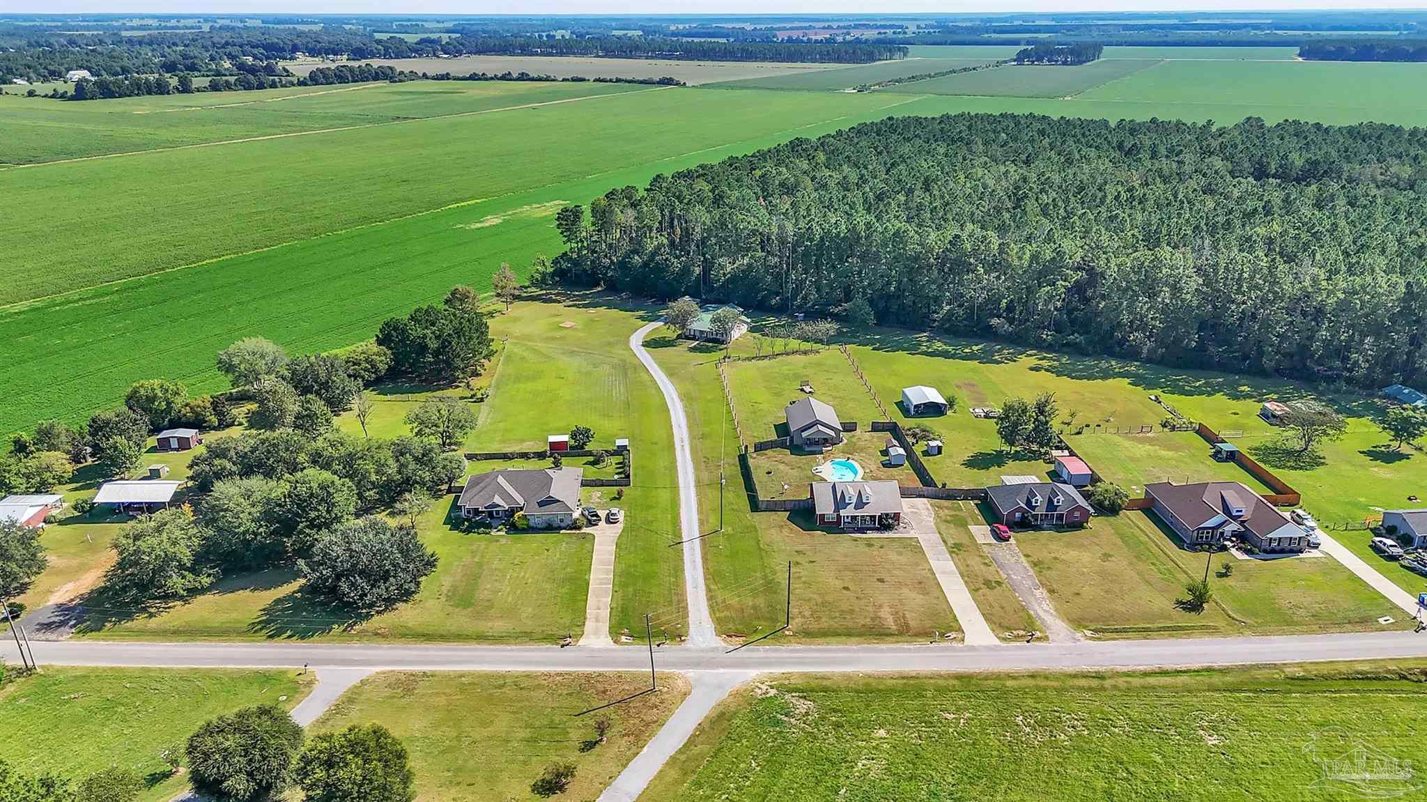 1770 Annie Penton Road Jay, FL 32565 - Photo 32 of 35 a view of a swimming pool with a yard