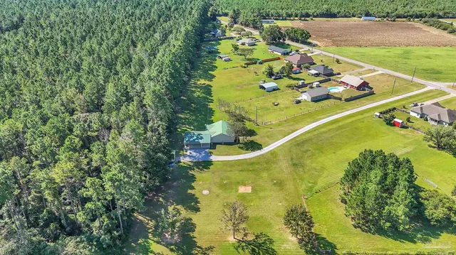a front view of a house with swimming pool