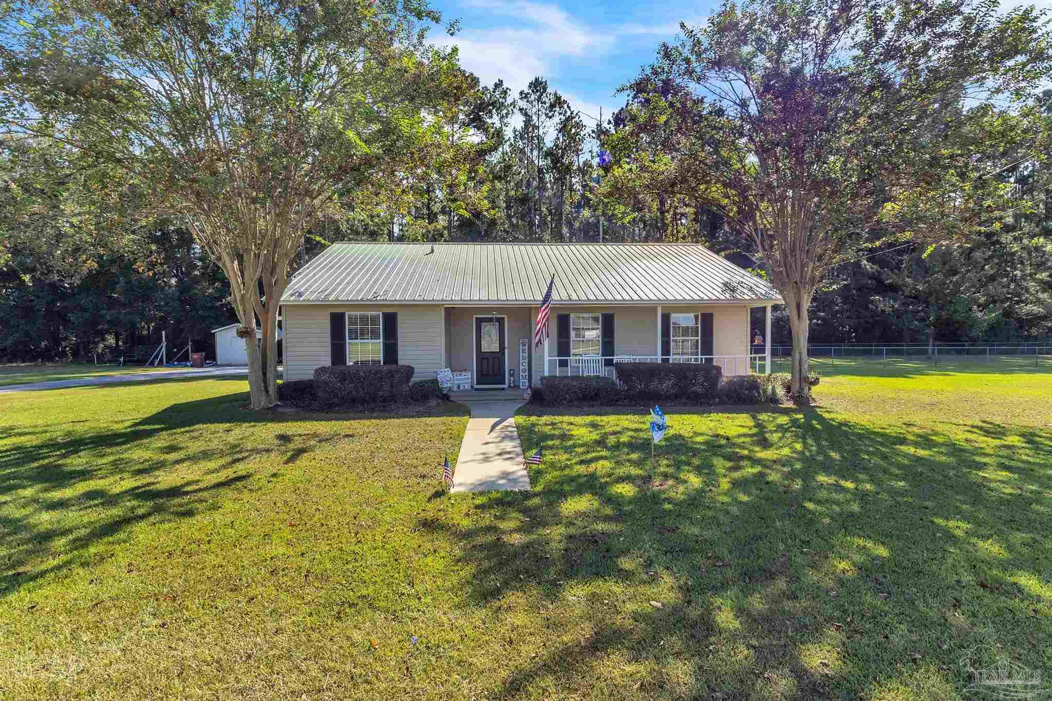 1770 Annie Penton Road Jay, FL 32565 - Photo 34 of 35 a front view of a house with swimming pool