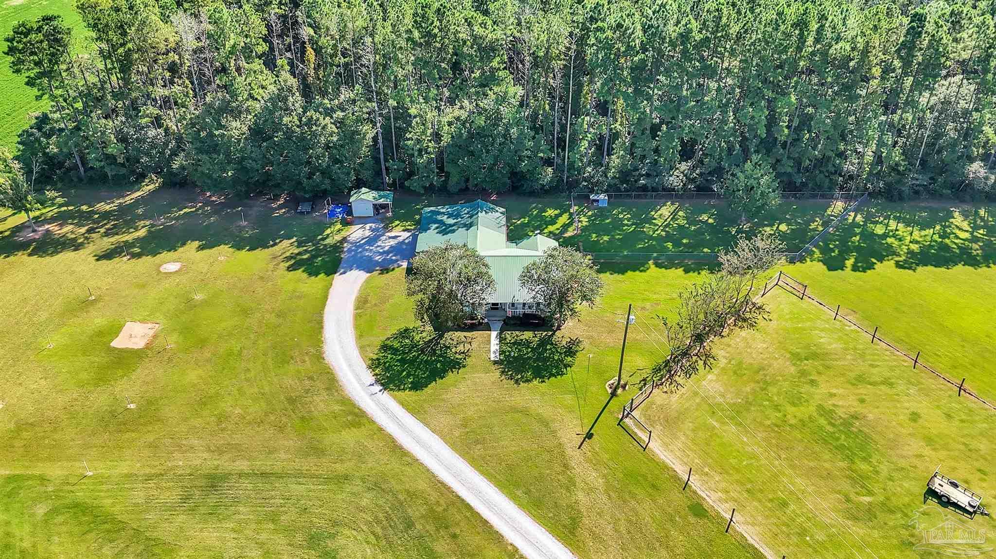 1770 Annie Penton Road Jay, FL 32565 - Photo 4 of 35 a view of a swimming pool with a yard