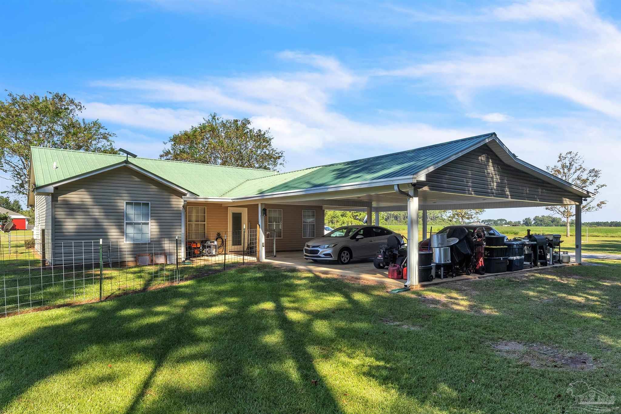 1770 Annie Penton Road Jay, FL 32565 - Photo 9 of 35 a view of a house with a yard and sitting area