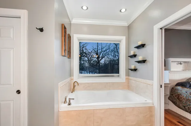 a bathroom with a bathtub and a shower