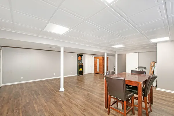 a view of a dining room with furniture and wooden floor
