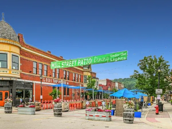view of a house with a yard and garden