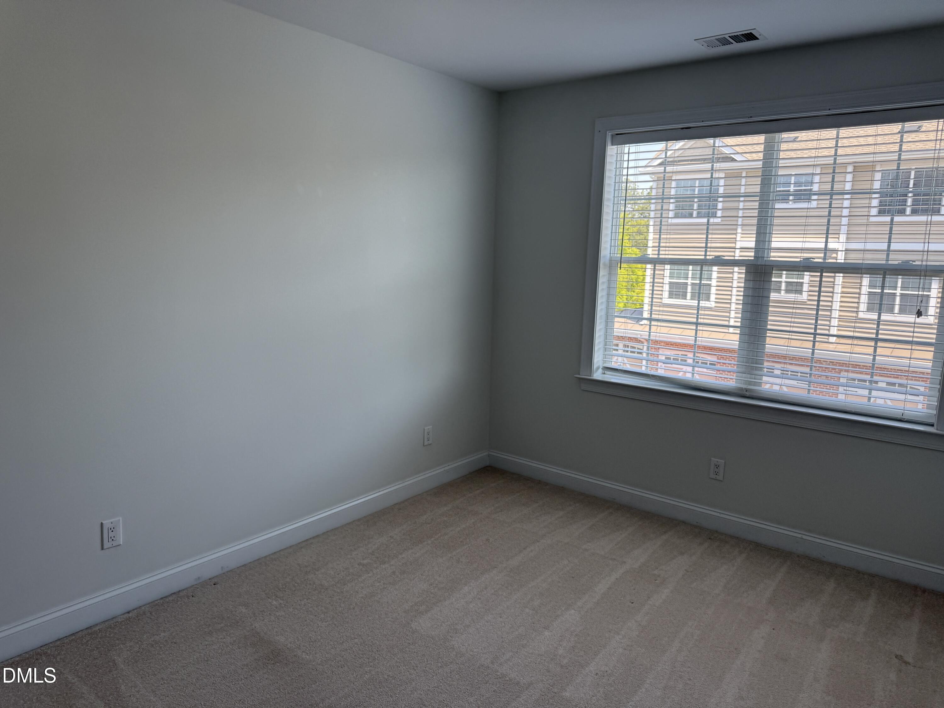 10511 Rosegate Court Raleigh, NC 27617 - Photo 13 of 26 an empty room with a window