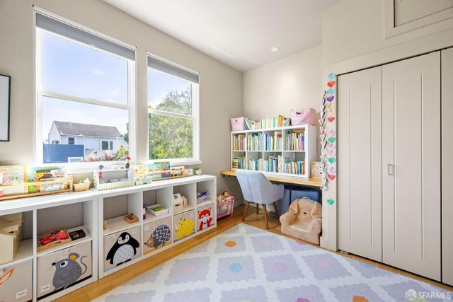 a very nice looking room with a large window and furniture