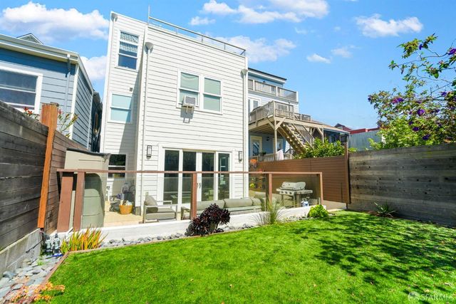 a view of a house with a yard and plants