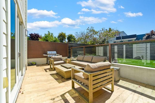 a view of a terrace with furniture