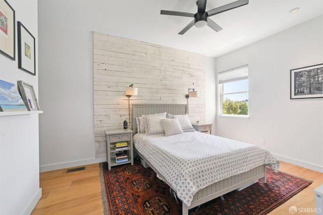 a bedroom with a bed and a table in it