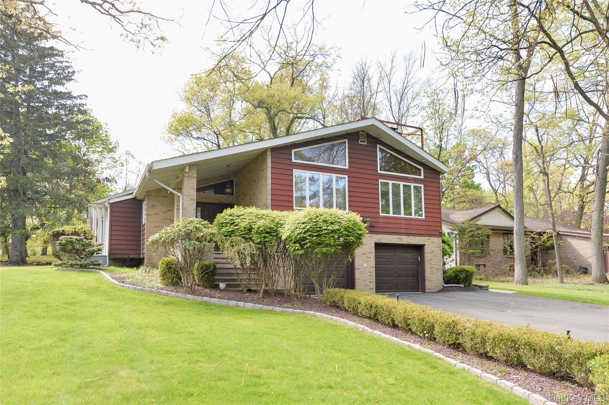24 Highview Road Monsey, NY 10952 - Photo 44 of 44 a front view of house with yard and trees in the background