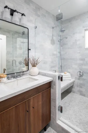 a bathroom with a double vanity sink and a bathtub