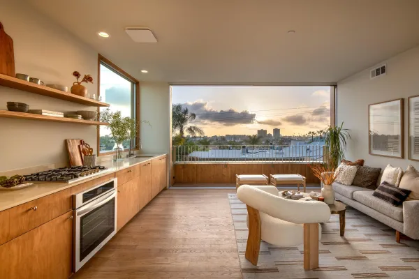 a kitchen with stainless steel appliances kitchen island granite countertop a sink and a stove