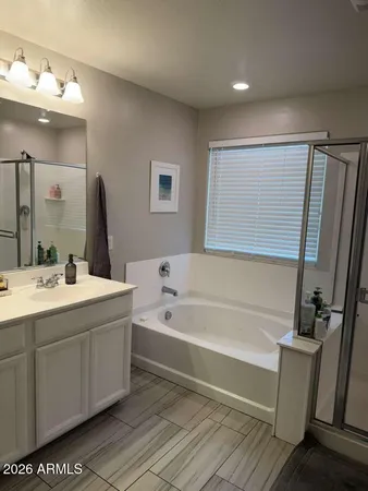 a bedroom with bed and window
