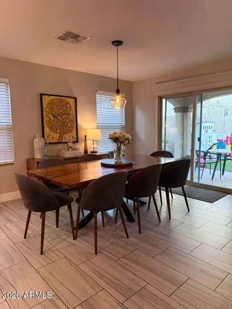 a kitchen with stainless steel appliances a sink a stove a refrigerator cabinets and wooden floor