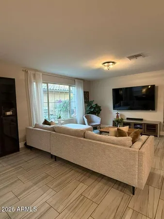 a living room with furniture and a table