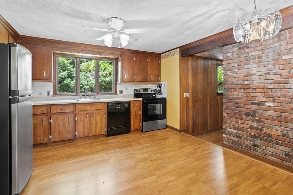 34 Duggan Road Acton, MA 01720 - Photo 13 of 42 a kitchen with stainless steel appliances granite countertop a stove a sink dishwasher and a refrigerator
