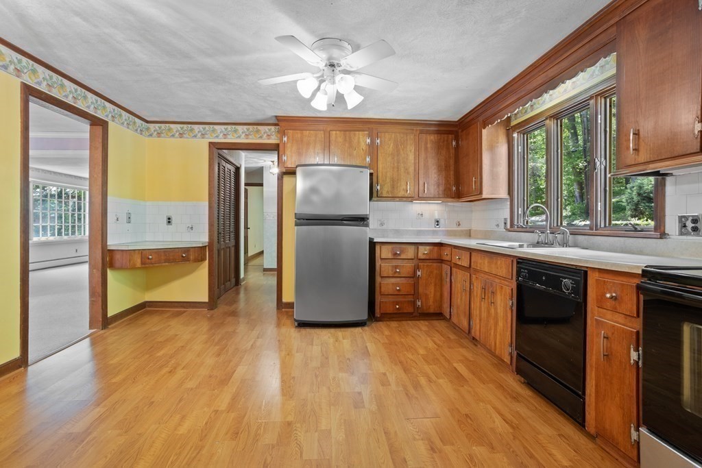 34 Duggan Road Acton, MA 01720 - Photo 15 of 42 a kitchen with a sink appliances cabinets and a large window