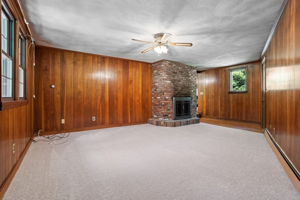 34 Duggan Road Acton, MA 01720 - Photo 18 of 42 an empty room with ceiling fan and windows