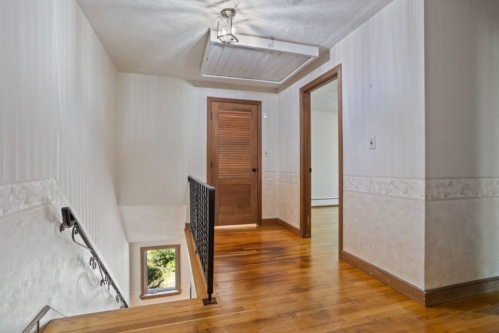 34 Duggan Road Acton, MA 01720 - Photo 22 of 42 a view of livingroom with furniture and wooden floor