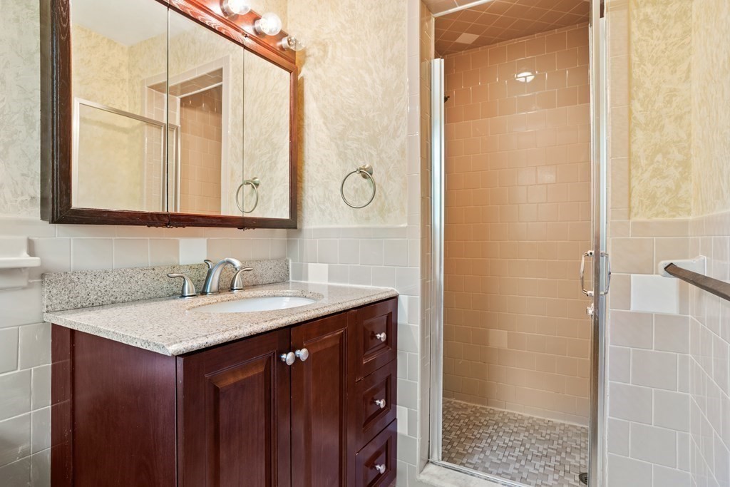 34 Duggan Road Acton, MA 01720 - Photo 24 of 42 a bathroom with a granite countertop sink and a mirror