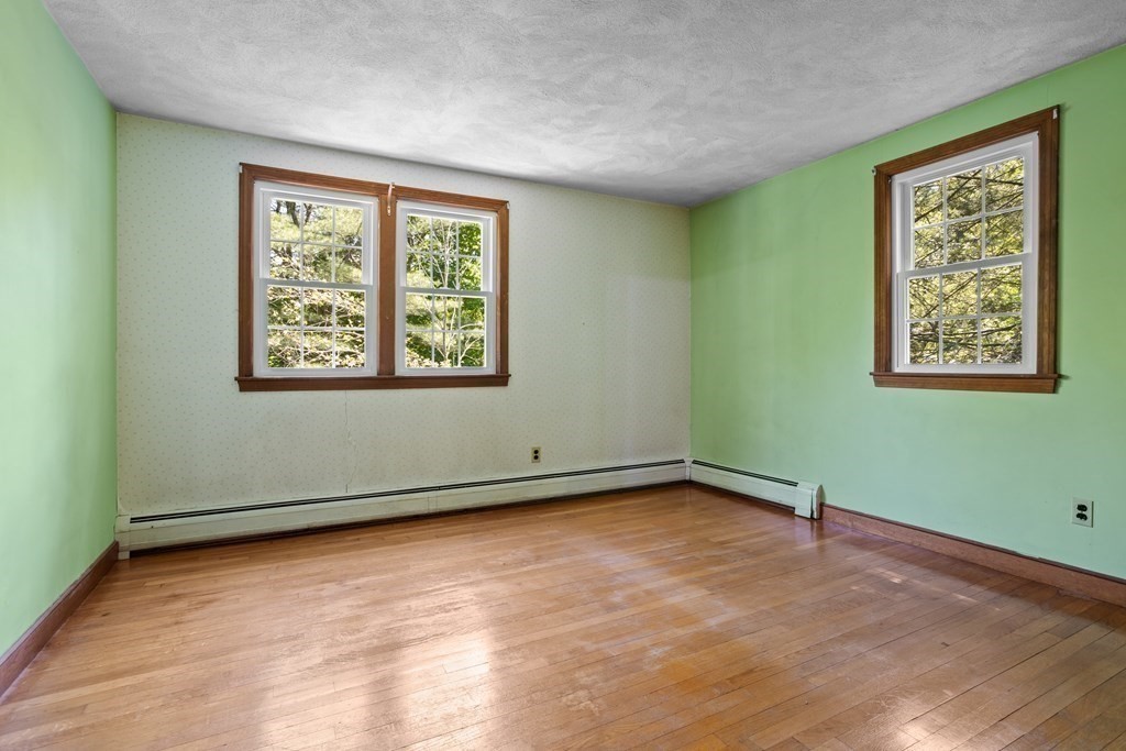 34 Duggan Road Acton, MA 01720 - Photo 28 of 42 a view of an empty room with a window and a window