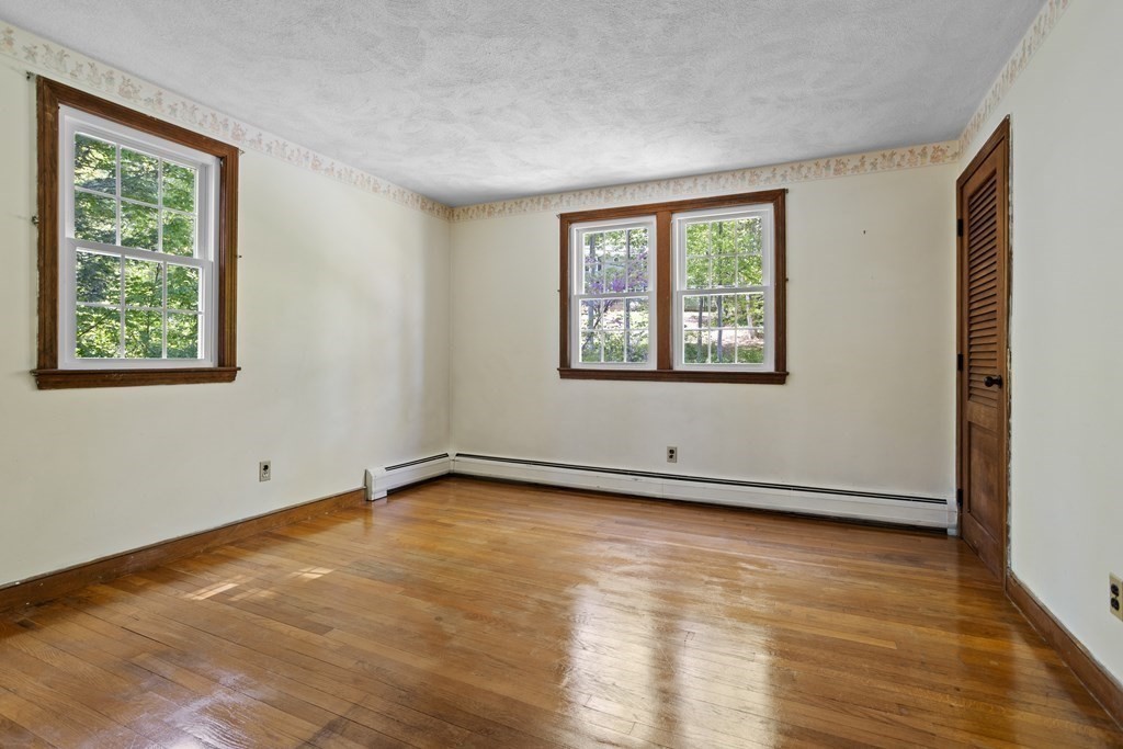34 Duggan Road Acton, MA 01720 - Photo 30 of 42 a view of an empty room with wooden floor and a window
