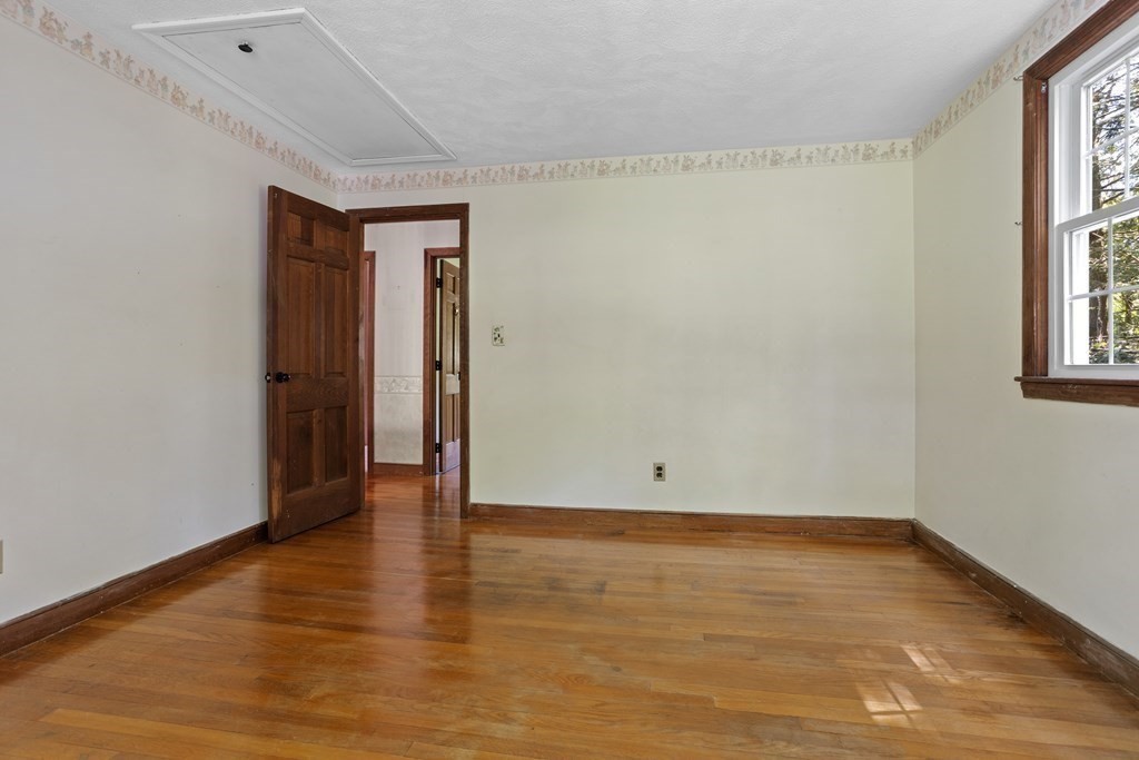 34 Duggan Road Acton, MA 01720 - Photo 31 of 42 a view of an empty room with wooden floor and a window