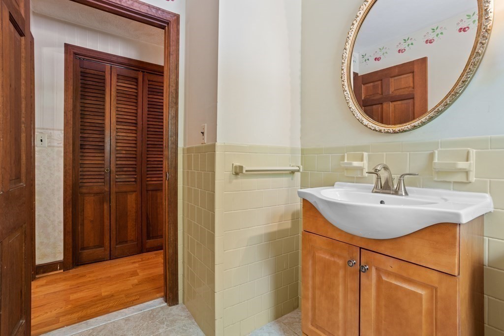 34 Duggan Road Acton, MA 01720 - Photo 8 of 42 a bathroom with a sink and a mirror