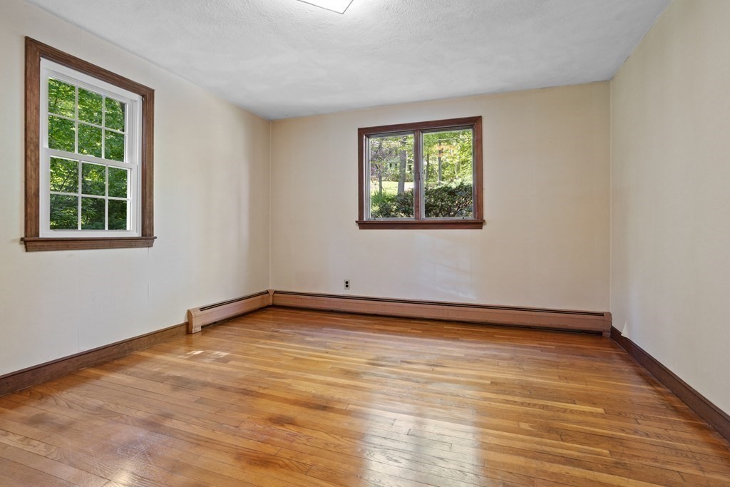 34 Duggan Road Acton, MA 01720 - Photo 10 of 42 a view of an empty room with wooden floor and a window